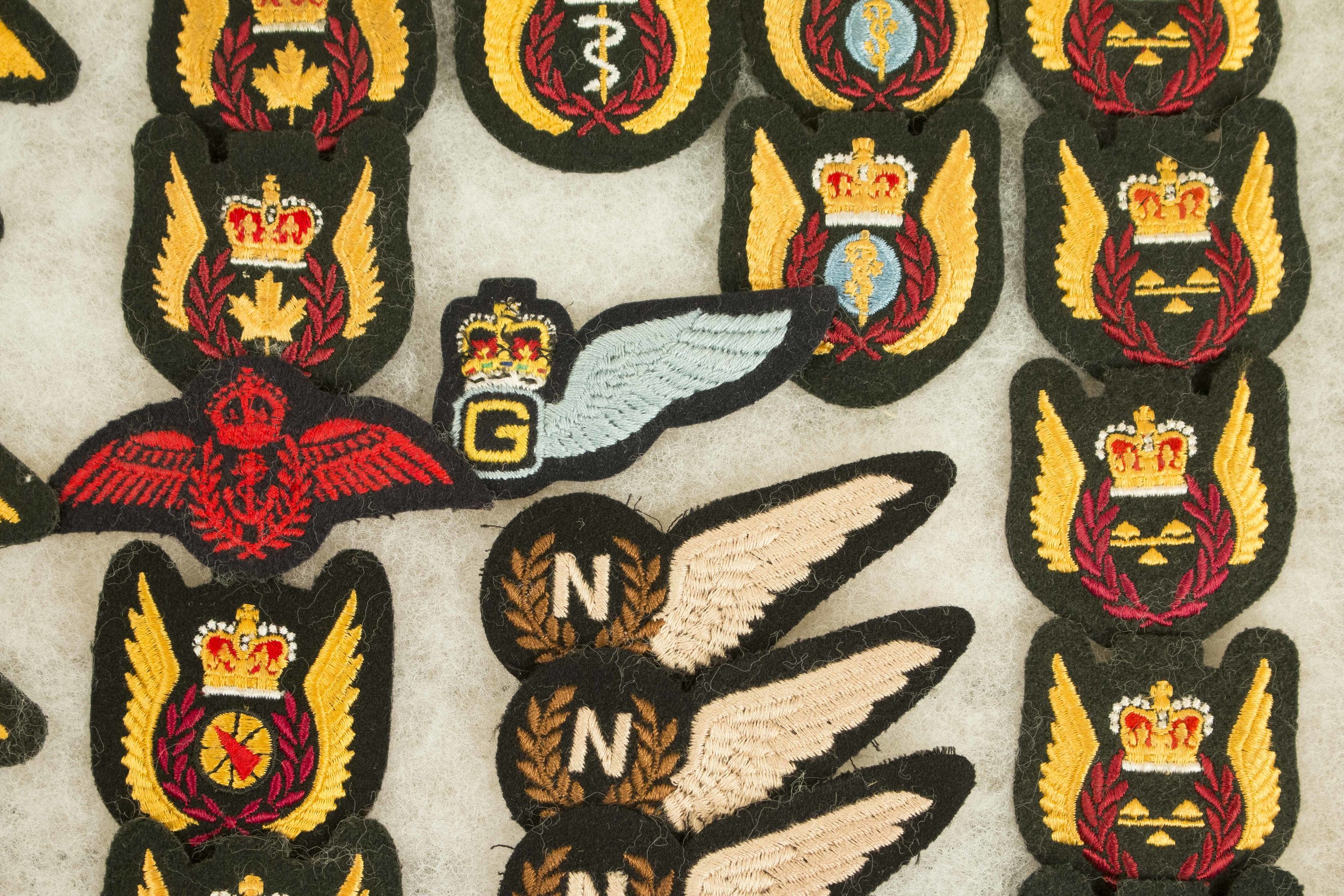 2 Frames of Cloth Canadian and British Wings, incl. 62 halfwings, 33