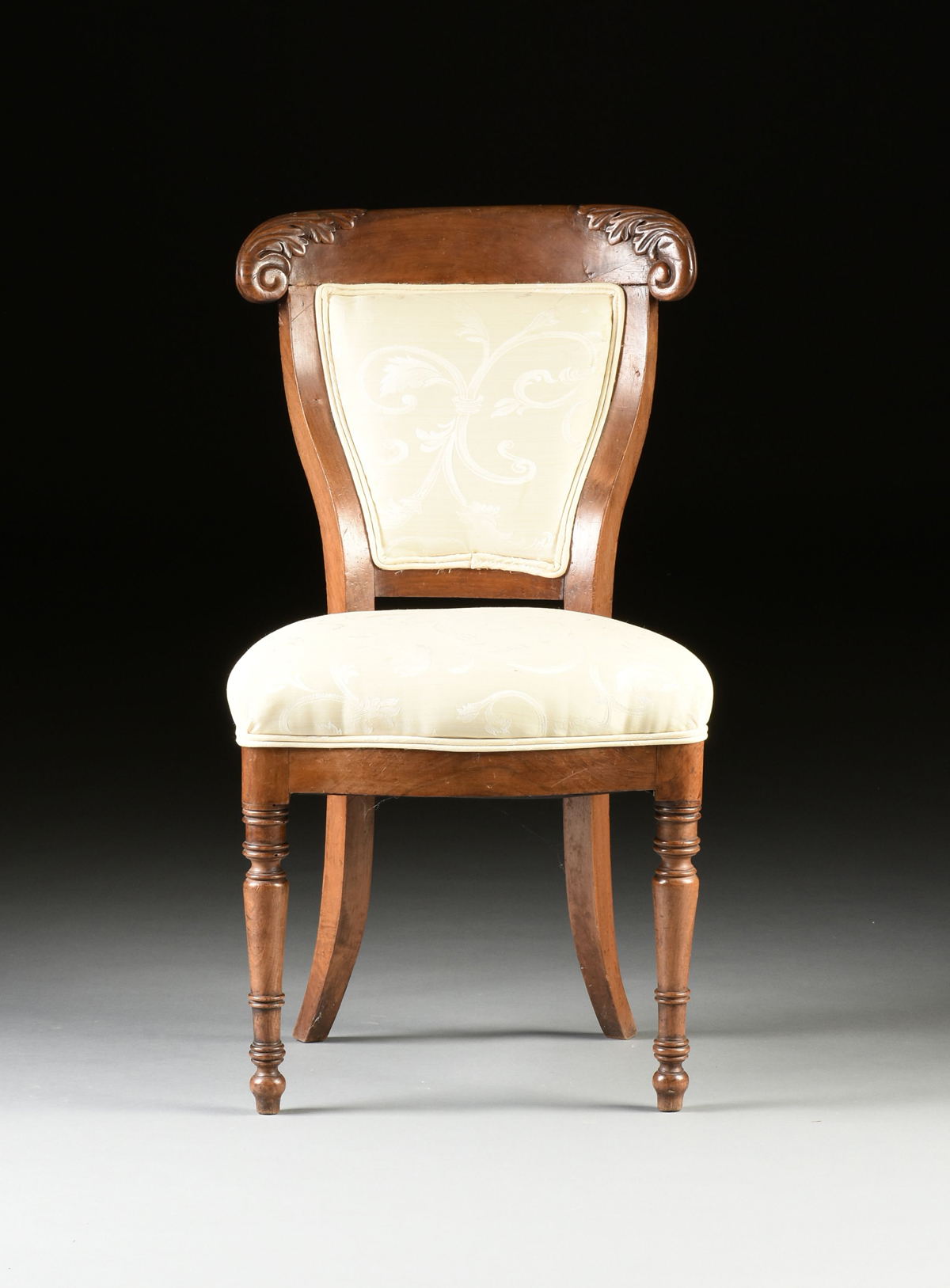 A SET OF THREE LOUIS PHILIPPE CARVED WALNUT SIDE CHAIRS, LATE 1840s